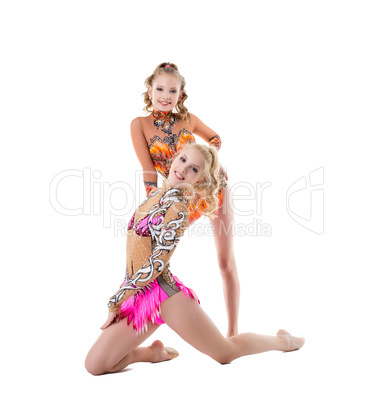 Studio photo of charming gymnasts perform in pair
