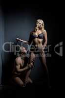 BDSM. Submissive guy on leash at his mistress