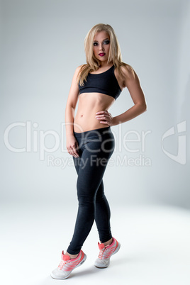 Studio photo of athletic woman with bright makeup