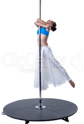 Graceful girl dancing on pylon. Studio photo