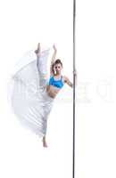 Lovely girl posing in vertical split on pole