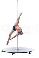Female dancer performs difficult trick on pylon