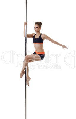 Image of cute dancer exercising on pylon