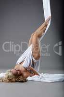 Aerial silk. Image of dancer seductively posing