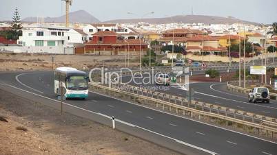 Timelapse shot of public bus, cars and trucks on highway on Fuerteventura