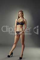 Fancy underwear. Pretty model posing in studio