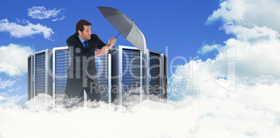 Composite image of man holding umbrella to protect himself from