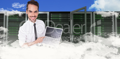 Composite image of smiling businessman pointing his laptop Composite image of smiling businessman pointing his laptop