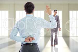 Composite image of businessman crossing fingers behind his back