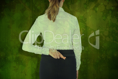 Composite image of rear view of businesswoman with fingers cross