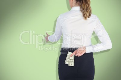 Composite image of businesswoman offering handshake with fingers