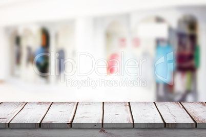 Composite image of wooden desk