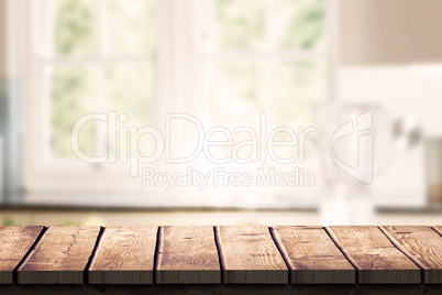 Composite image of wooden desk