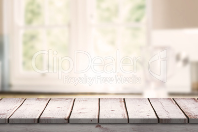 Composite image of wooden desk