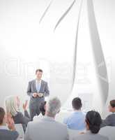 Composite image of businessman doing speech during meeting