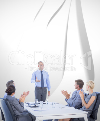 Composite image of business people applauding during meeting