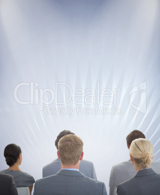 Composite image of business team during conference