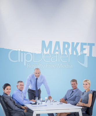 Composite image of happy business people looking at camera