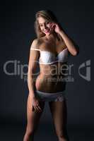 Girl with athletic body dressed in erotic lingerie