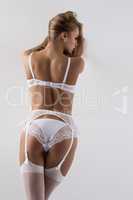 Rear view of model posing in sexy bridal underwear