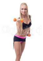 Cute athletic blonde exercising with dumbbells