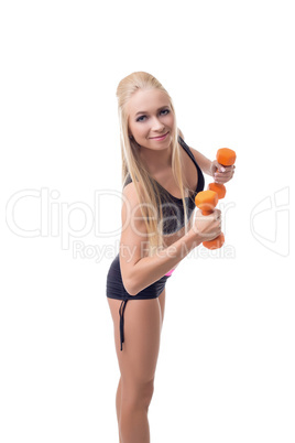 Sexy trainer demonstrates exercise with dumbbells