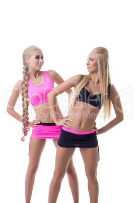 Sporty girls exercising and looking at each other