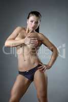 Hot female bodybuilder posing naked to waist