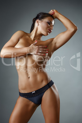 Image of sexy topless bodybuilder posing at camera