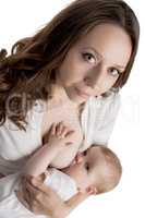 Portrait of pretty mother feeding breast her baby