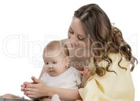 Loving mother playing with her little daughter