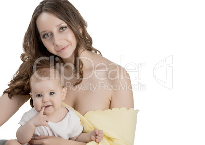 Studio portrait of pretty woman and her baby