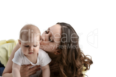 Loving mother kissing her adorable little child