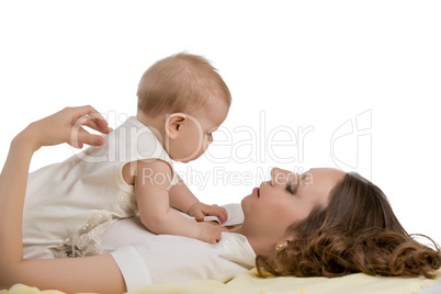 Childcare. Photo of mother plays with her baby