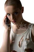 Portrait of skinhead girl talking on phone