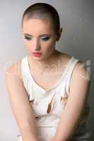 Image of beautiful skinhead girl in ragged t-shirt