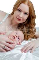 Portrait of mother and her baby, isolated on white