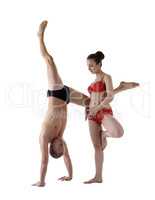 Paired yoga. Man and woman performing asanas