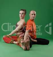 Yogis posing at camera while performing asana