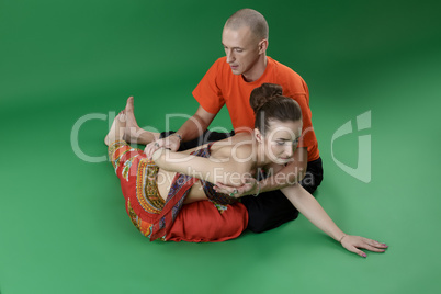 Experienced yoga instructors while doing asana