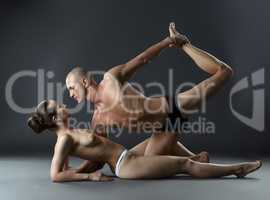 Nude people practising modern wellness yoga