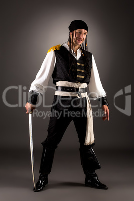 Man posing as pirate at camera. Studio photo
