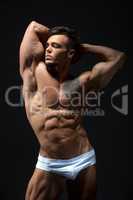 Attractive young man with muscular fit body