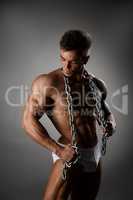Male underwear model shows his muscular body