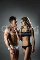 Fitness and love. Pretty girl with her hot trainer