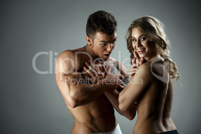 Image of man admires woman's body and she laughs