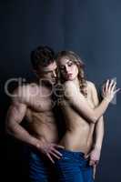 Erotica. Strong man touching sensual woman