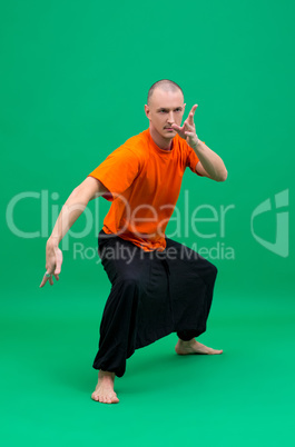 Image of middle-aged yogi doing asana