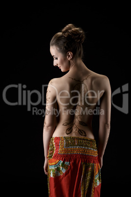 Mehndi. On woman's back henna pattern dreamcatcher