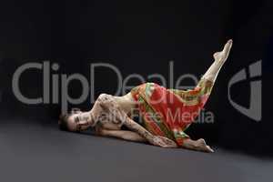 Mehendi and yoga. Studio shot of woman doing asana